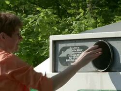 MS woman throwing bottles in bottle bank / Saarburg, Rhineland-Palatinate, Germany Stock Footage