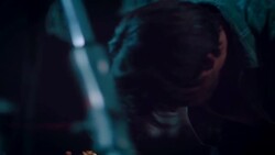 Man in motorcycle workshop grinding a piece of metal Stock Footage