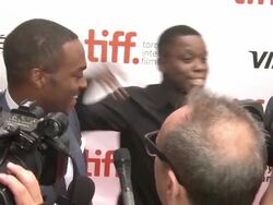 Anthony Mackie and Mpho Koaho - 'Black And White' Premiere - 2014 Toronto International Film Festival Stock Footage