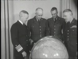 The Joint Chiefs of Staff Admiral Forrest P. Sherman, General Omar N. Bradley, General Hoyt S. Vandenberg, and General J. Lawton Collins stand around a globe. News Clip
