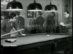 1944: U.S. SOLDIERS & POST-WAR JOBS: EXT MS Sign 'Welcome to All Men of the Armed Forces.' DRAMATIZATION: INT VS U.S. Army men playing pool, talking about post-war jobs & opportunities. Employment, unemployment. Post WWII Instructional Video