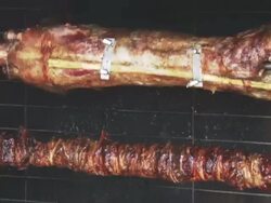 MS Roasting lamb and kokoretsi in  open oven / Greece Stock Footage