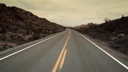 Driving shot down lonely desert road (fast motion) Stock Footage