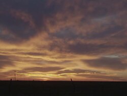 WS View of Beautiful orange and blue sunset over rural landscape / Sanford, Texas, United States Stock Footage
