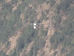 MS TS Prop Aircraft Pilatus Porter taking off on small Runway of Lukla Airport near Khumbu Valley / Lukla, Khumbu Region, Nepal Stock Footage