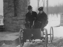 Henry Ford and his wife in his first car Stock Footage