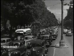 1943: MEXICO CITY: HA WS Mexico City, buildings. WS Traffic on Mexico street. LA Tall building (possibly apartments). WS Mexicans on horseback on street. WS Mexican movie posters, billboards. WS Crowded street, Mexicans, pedestrians. Instructional Video