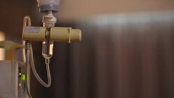 Infusion bottle with IV solution to help patient Stock Footage