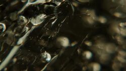 Ice cube melting in ultra close up Stock Footage