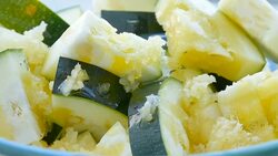 slices of zucchini with minced garlic Stock Footage