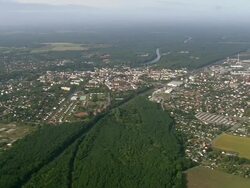 WS AERIAL View of town with forest, river, farmland and railway tracks / Germany Stock Footage