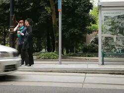 WS PAN Two women walking and talking after leaving streetcar / Portland, Oregon, USA Stock Footage