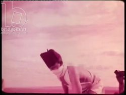 Sahara, Algeria, 1954 - Colom Bechar, camels, and vehicles driving through roads and water Stock Footage