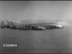 1952: DWIGHT EISENHOWER:  WS Variation of the Lockheed Constellation 'Connie' transport airplane flying. INT VS Dwight 'Ike' Eisenhower sitting in passenger seat, eating, another male joining. General Dwight D. Eisenhower (US President), campaigning Instructional Video