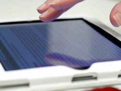 Close-up,Female using tablet computer to scroll through information Stock Footage
