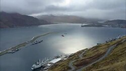 A storm races over a small fishing harbor. Stock Footage