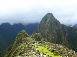 WS T/L HA View of tourist at Machu Picchu and clouds low over mountains / Machu Picchu, Peru Stock Footage