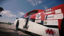 Driver speeds out of pit-road, pit-crew celebrates job well done Stock Footage