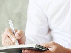 Close-up hands writing on the paper Stock Footage