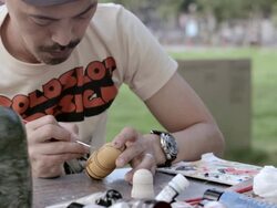 MS Artist making Matryoshka doll at the park / Nerima, Tokyo, Japan Stock Footage