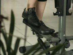 HD DOLLY: Woman Exercising On The Stair Climbing Machine Stock Footage