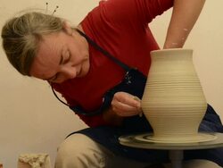 MS TU Shot of female potter shapes pitcher on potterwheel at pottery / Landshut, Bavaria, Germany Stock Footage