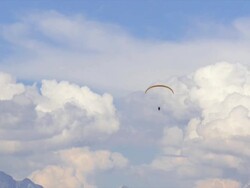 HD Paraglider in front of high mountain range Stock Footage