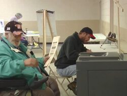 CU, ZO, MS, Man in wheelchair casting his vote in ballot box then leaving, St. Marys, Ohio, USA Stock Footage