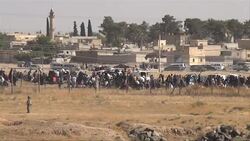 CLEAN : Turkish forces push massing Syrians from border: AFP News Clip