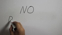 Hand writing a 'No Racism' message on a white board using a black marker Stock Footage