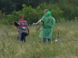 MH17 Crash site workers and body bags News Clip