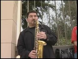 Horror-film writers perform producers' exorcism in front of movie studio News Clip