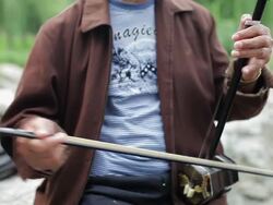 CU Old man playing chinese traditional musical instruments(Erhu) in park /Xi'an, Shaanxi, China Stock Footage