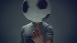young male soccer freestyler spins a ball on his fingers Stock Footage