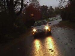WS POV Electric car passing through countryside in rain / Rochester, Michigan, United States Stock Footage