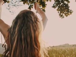SLO MO Swinging on a tree swing Stock Footage