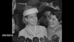 Grace Kelley, fianc_ of Prince Rainier III, meets press prior to departure for Monaco wedding in 1956 News Clip