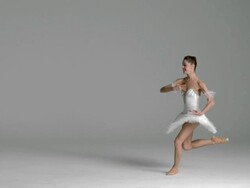 slow motion of ballerina performing grand jetÃƒÂ© in studio Stock Footage