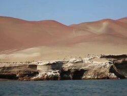 WS POV side View from boat of Pisco bay, peninsular / Paracas, Nazca, Peru Stock Footage