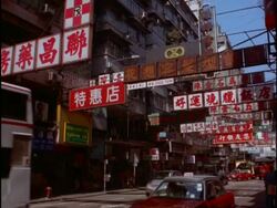 MS Traffic and signs in city street, Kowloon, Hong Kong Stock Footage