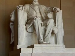 Tilt shot of the Abraham Lincoln statue inside the Lincoln Memorial in Washington DC Stock Footage