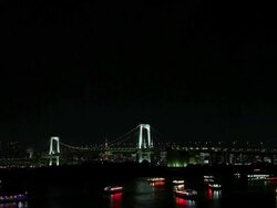 WS Bridge and boats at night in Odaiba Tokyo Bay / Tokyo, Japan Stock Footage