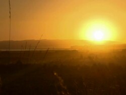 Yellow sun setting behind mountain, time lapse shot from Santa Rosa, Bolivia Stock Footage