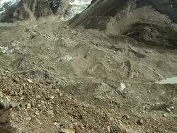 Panorama of a glacier flowing down a valley from the Himalayas. Stock Footage