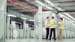 Business people talking in paper mill Stock Footage