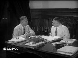 1953: GOA, INDIA: Governor-General of Portuguese India Paulo Benardo Guedes at desk, March of Time director Dwight Godwin asking about colonialism, Guedes SOT (Portuguese w/ English translation) saying Goa not colony but province, all Portugal citizens. Instructional Video