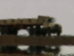 WS TS abstract view of same trucks running in desert with hot atmosphere / Djibouti Stock Footage