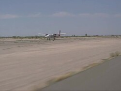 A skydiving plane powers up and takes off the runway. Stock Footage