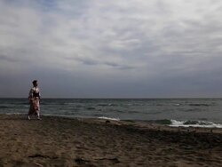 Japanese woman walking by the sea Stock Footage