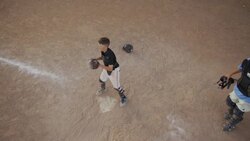 High angle slow motion medium shot of baseball player sliding to home plate / American Fork, Utah, United States Stock Footage